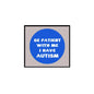 Autism acceptance pinback badge with blue circle and white text on square backing