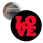 Round pinback button with bold red "LOVE" letters on a black background