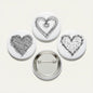 Heart scribble pinback set, 2.25-inch: three white buttons with black heart designs