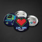 Set of 3 pixel geek pinback buttons with heart, loading, and Lvl Up! designs