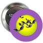 Round purple pinback button with yellow moon and flying black bats graphic