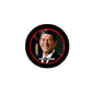 Ronald Reagan pinback button: black circular badge with red frame and 1911–2004 text