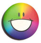 Round multicolor emoticon pin badge with smiling face design, rainbow gradient background