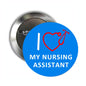 Round nursing assistant pin with blue face, red stethoscope-heart icon, white lettering
