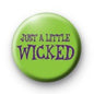 Round green pinback button with the text “JUST A LITTLE WICKED”