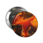 2.25-inch round pinback button with orange-red pigment splash artwork