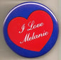1.25-inch pinback button with blue border, red heart, and white “I Love Melanie” text
