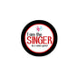 2.25-inch pinback button with black rim and white face, red 'I am the SINGER' text