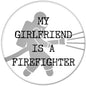 Round firefighter pinback with text: 'My Girlfriend Is a Firefighter' and shield silhouette