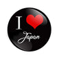 Round pinback button with black face, white 'I ♥ Japan' text and red heart.