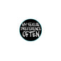 2.25-inch pinback button with black circular face, teal border, and slogan text