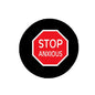 Round black pinback brooch with red STOP ANXIOUS octagon design