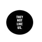 2.25-inch black pinback button with white "THEY NOT LIKE US." text