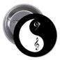 Round yin-yang pinback button with black and white music note symbols, 1.25-inch