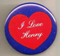 Red heart pinback button with "I Love Henry" script on blue background