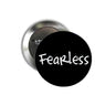 1.25-inch pinback button with black face and white Fearless text