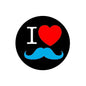 Round pinback button with black background, white “I”, red heart, and blue mustache