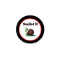 Pinback button with “Snailed It” text, snail illustration, black rim and red border