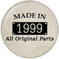 1999 pinback button, circular beige fabric with “MADE IN 1999” and “All Original Parts”
