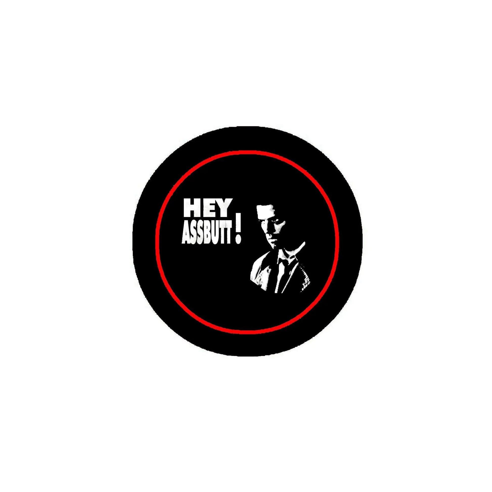 Round black pinback badge with red border; 'HEY ASSBUTT!' text and face graphic