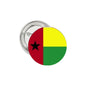 Guinea flag pin-back badge with red, yellow, green halves and black star