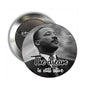 Round pinback button with black-and-white Martin Luther King Jr portrait and text "The dream is still alive"