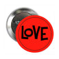 LOVE graphic pin badge with red circular face, black lettering, and silver pin back