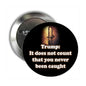 2.25-inch pinback button, black, 'Trump' and 'been caught'.