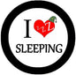 1.25-inch pinback button, black rim, 'I SLEEPING' text, red Zzz heart
