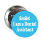 Round metal pinback button with "Smile! I am a Dental Assistant" text