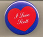 Heart-shaped pinback button with red heart and white “I Love Scott” script, blue rim