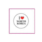 North Korea pinback button badge, round white face with black text and red heart