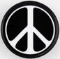 Round peace sign pinback button with black center and white peace symbol