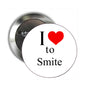 Round silver pinback button with 'I love to Smite' text and red heart
