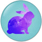 2.25-inch round pinback button with purple rabbit silhouette on teal dotted background