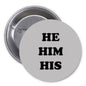 1.25-inch pride pinback, round gray button with black 'HE HIM HIS' and metal pin