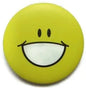 Round yellow smiley emoticon pin badge with big grin and wide eyes