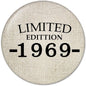 Round 2.25-inch pinback button with beige fabric look and black 'LIMITED EDITION 1969-' text