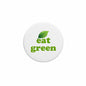 Eat green slogan pinback button, 2.25-inch, black rim with green leaf and text