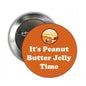 Round button pinback brooch, orange center with “It’s Peanut Butter Jelly Time”