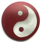 Red and white yin yang pin badge with circular design