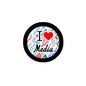 2.25-inch round pinback badge with black rim, colorful I Heart Media design