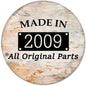 2009 pinback button with “MADE IN 2009” and “All Original Parts” on rustic background