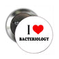 Bacteriology pinback button brooch, round metal with white face, red heart and 'I ♥ Bacteriology'