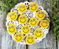 Set of round yellow soccer smiley button pins with black-and-white ball eyes