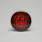 Round 2.25-inch pinback button with red and black 666 graphic