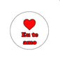 Round pinback badge with red heart and 'Eu te amo' lettering
