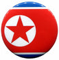 Red North Korea flag enamel pin with white circle and red star, blue border