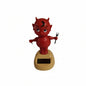Solar-powered devil car ornament swing doll with red figurine on tan base and black solar panel