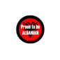 Red pinback badge with black border, text 'Proud to be ALBANIAN' and eagle emblem